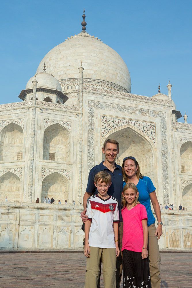The entire Earth Trekker family stand for a photo in front of the Taj Mahal.
