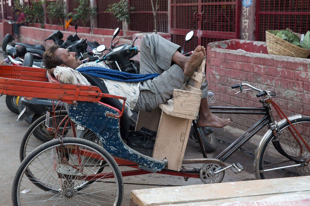 Sleeping rickshaw driver