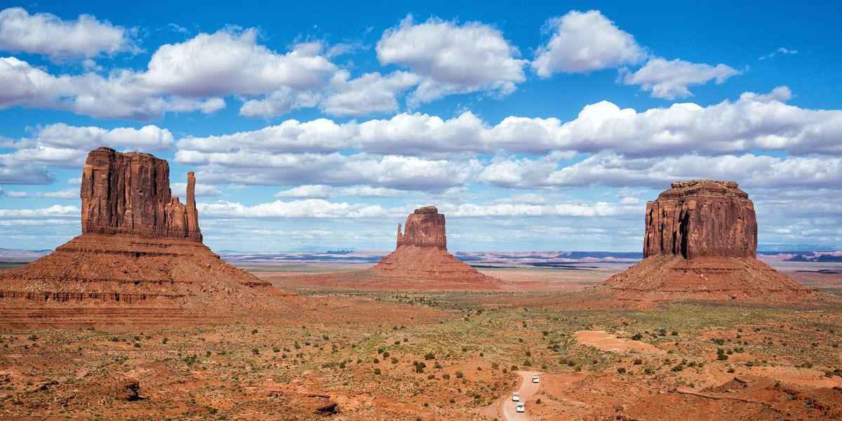 a landscape with a large rock formation